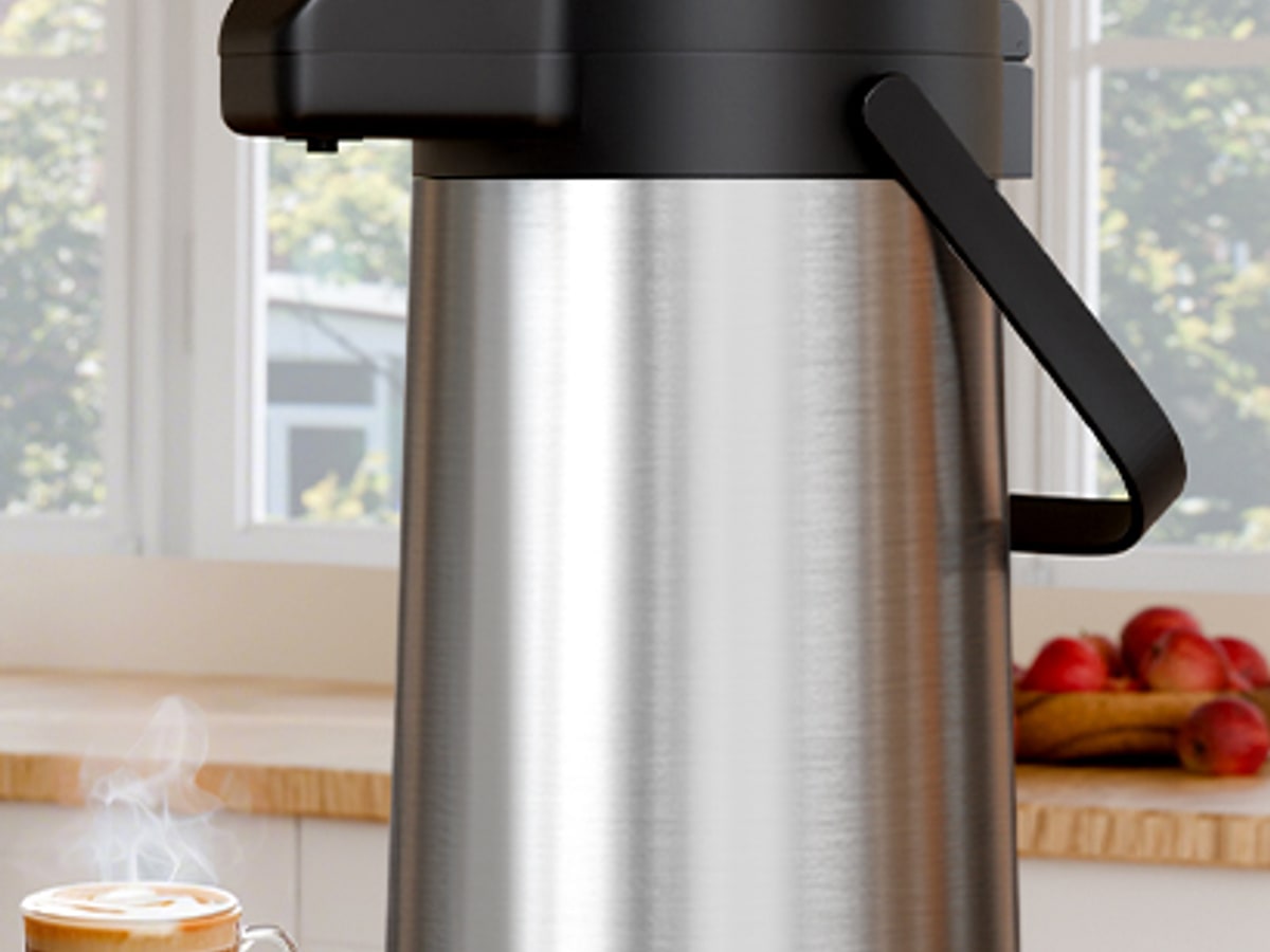 Gezoss 102 oz Stainless Airpot on a warm kitchen counter with coffee cups and morning light